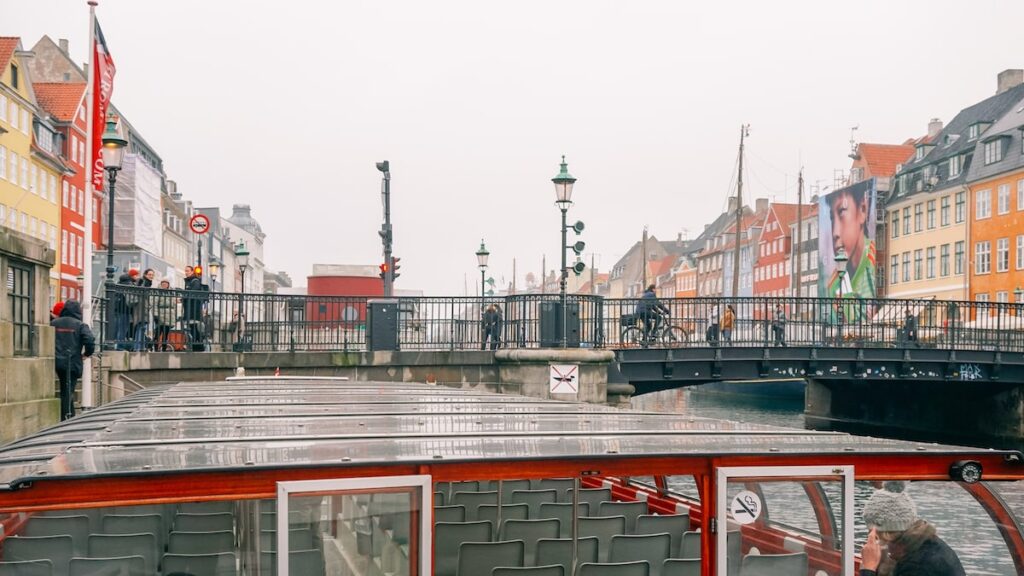 The boat of the tour and Nyhavn in the background