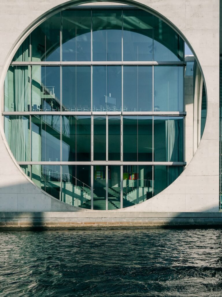 Building with a big circular window at the Government District in Berlin