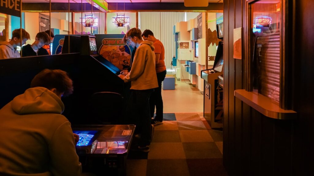 People playing arcade games