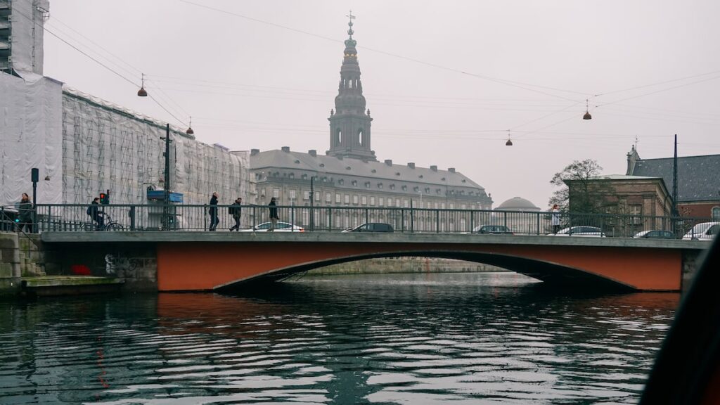 View of a Copenhagen bridge from the water during a canal cruise