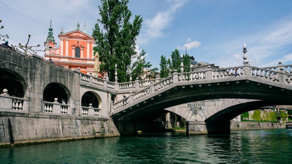Water level view of the Triple Bridge in Ljubljana, Slovenia