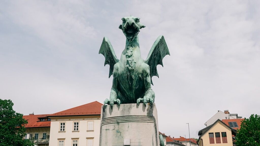 A dragon statue in the Dragon Bridge of Ljubljana