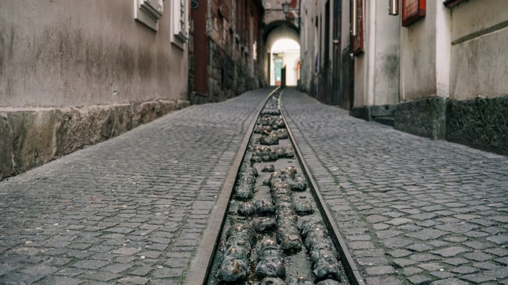 Locksmith street with engraved statues skulls in Ljubljana
