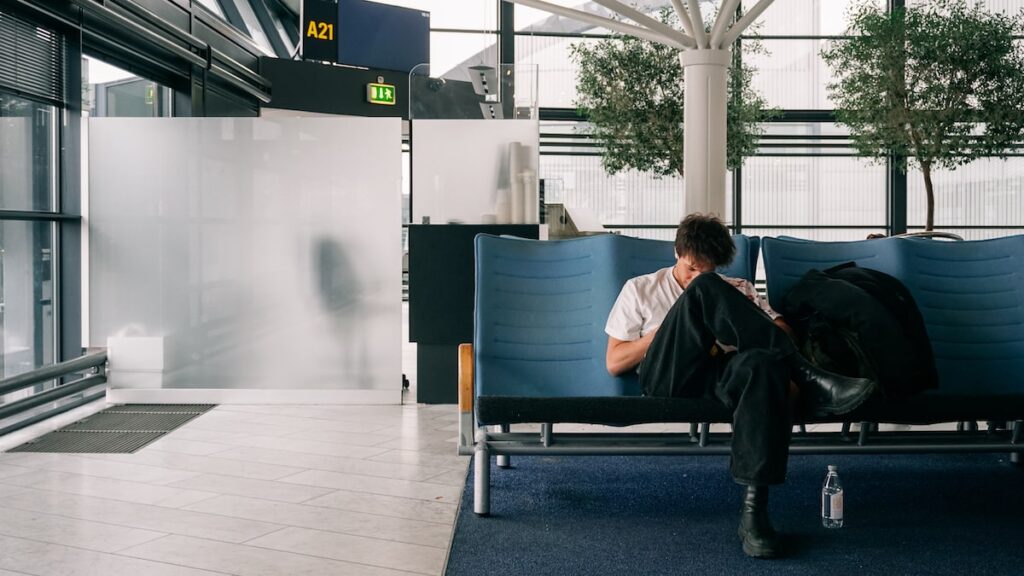 A passenger waiting for his flight at Copenhagen Airport in Denmark
