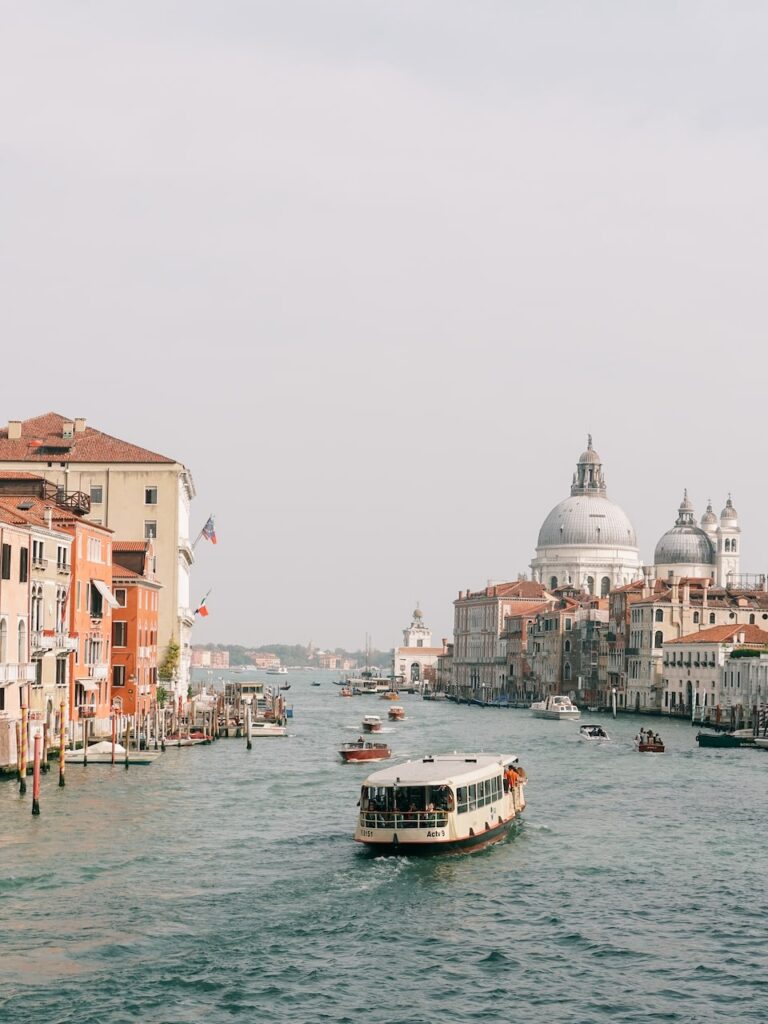 A boat crossing the Ponte dell' Accademia in Venice