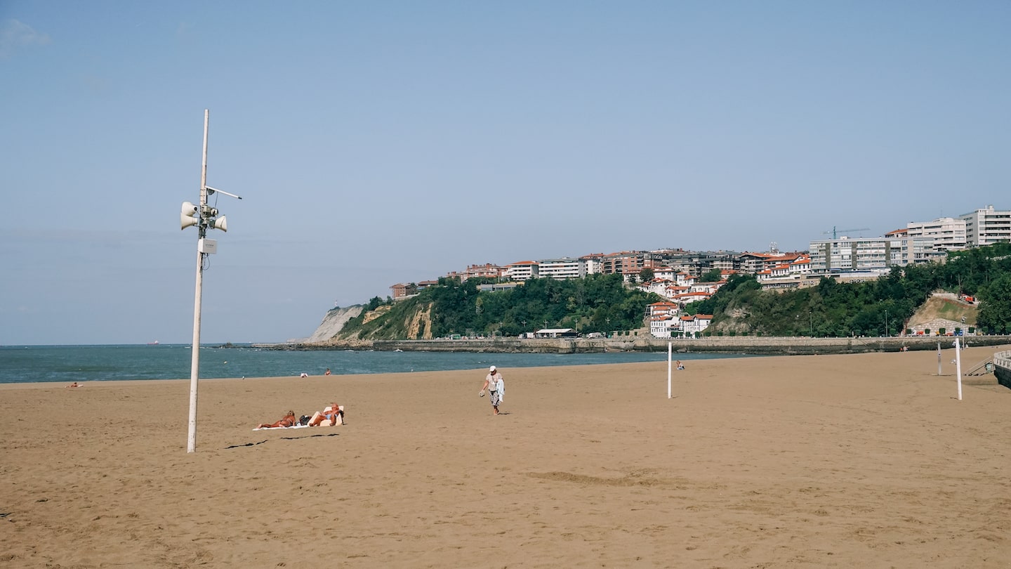 People enjoying the sea at Getxo, Spain. The image serves as the cover photo for a Getxo travel guide written by George Pavlopoulos for the travel blog Letters to Barbara