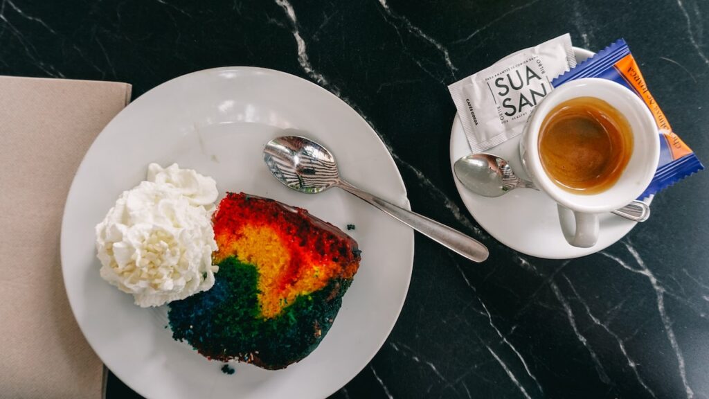 A cup of espresso and a colorful sweet served at the Sua San Restaurant in Bilbao