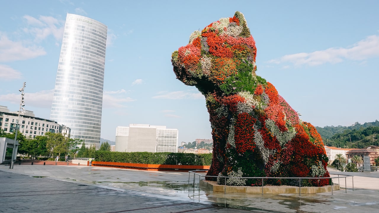 The Puppy by Jeff Koons in front of the Bilbao Guggenheim Museum is one of the top things to see in town