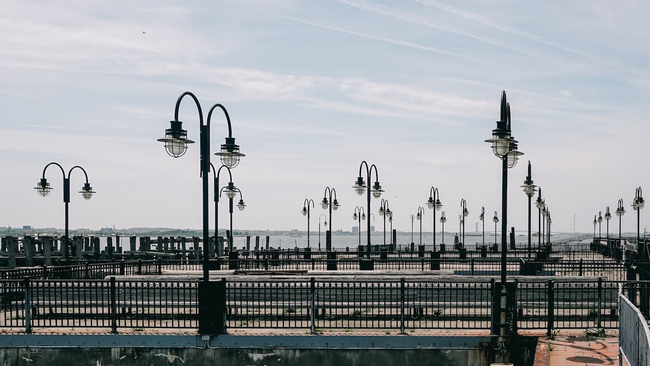 Lamps and sea while waiting for the ferry to Ellis Island