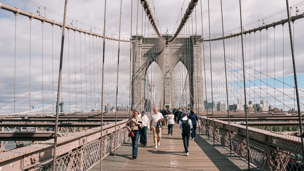 People walking the Brooklyn Bridge in New York