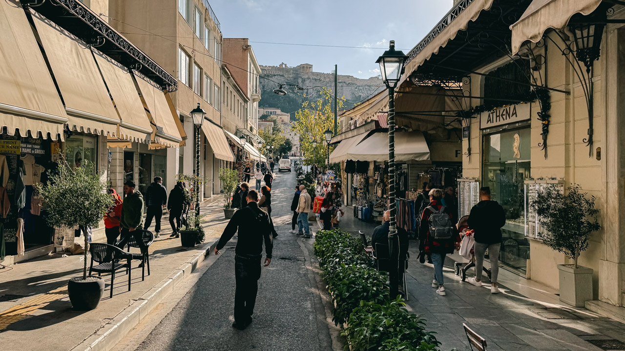 Aiolou Street in Plaka Athens and the Acropolis of Athens in the background