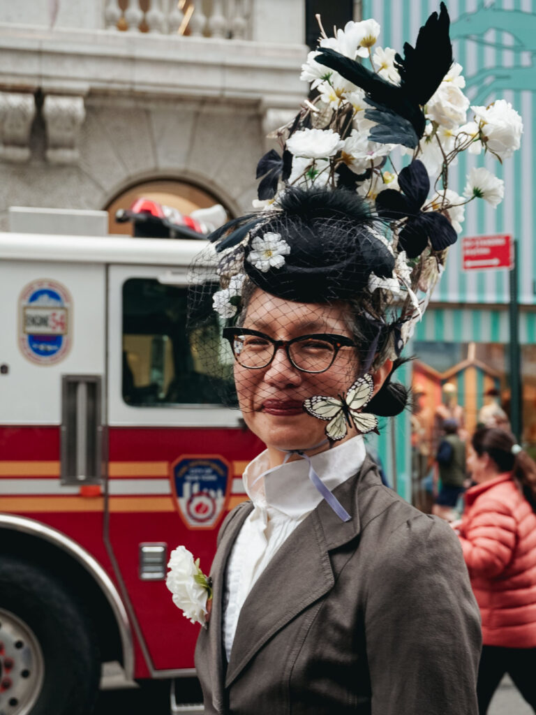 A lady with a floral hat during the New York Easter Parade and Bonnet Festival
