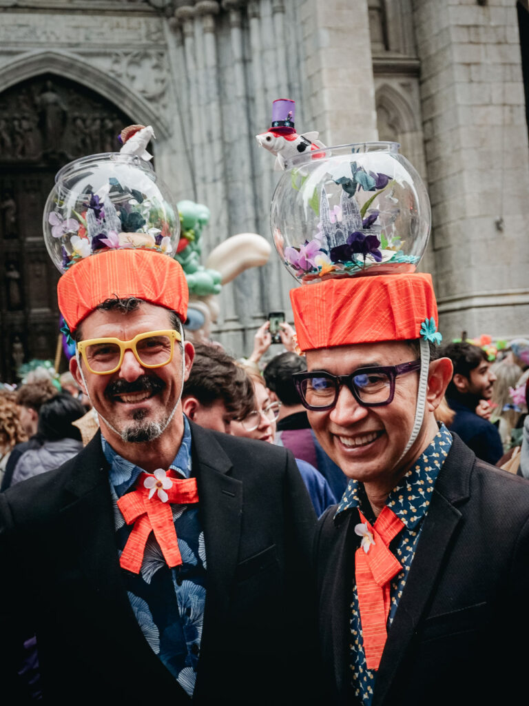 Two men with fish bowls on their heads in the New York Easter Parade Bonnet Festival
