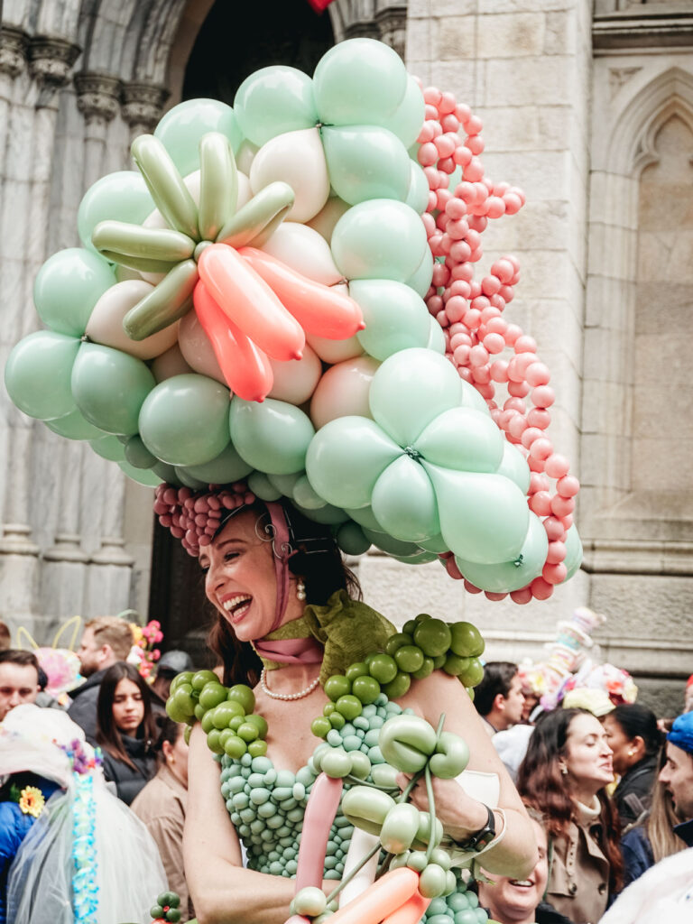 A woman with a balloon hat in NYC Bonnet Festival