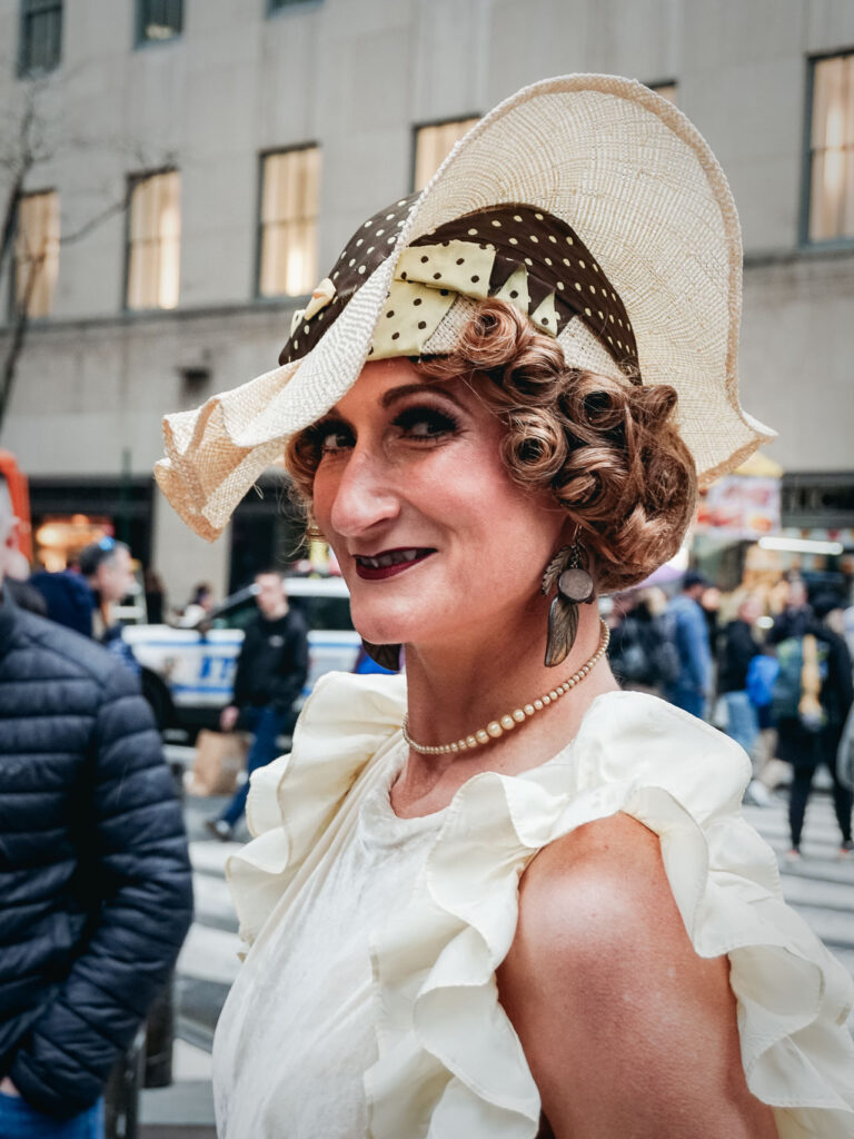 A lady with a vintage hat and style posing in the New York Easter Parade and Bonnet Festival