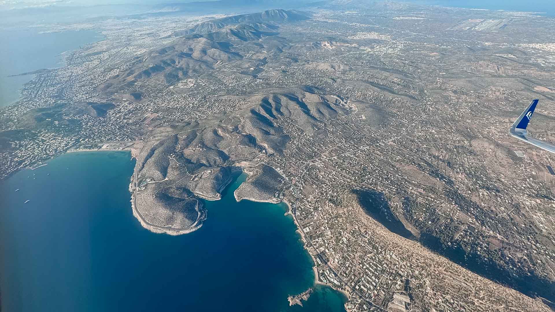 Flying over Athens on business class seat with Aegean Airlines