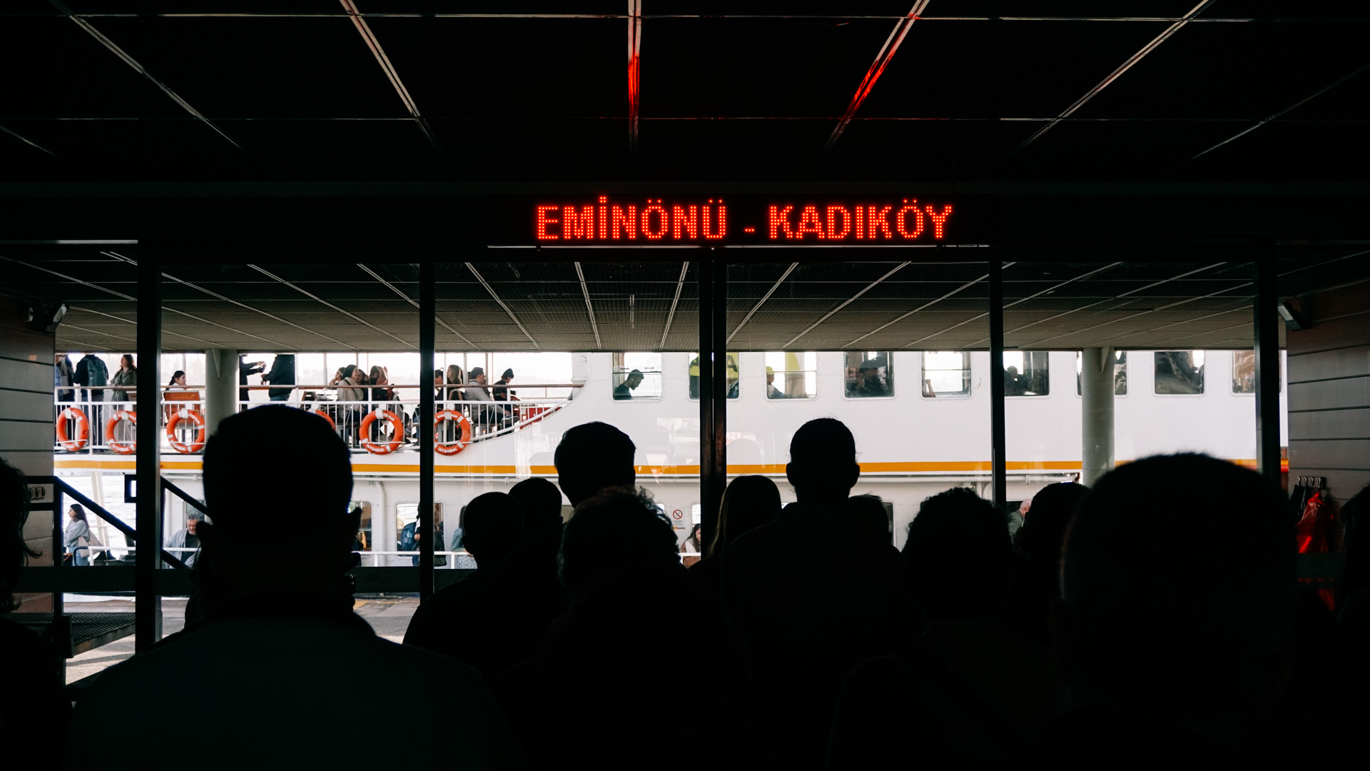 People waiting to embark on a Karaköy to Kadıköy ferry in Istanbul