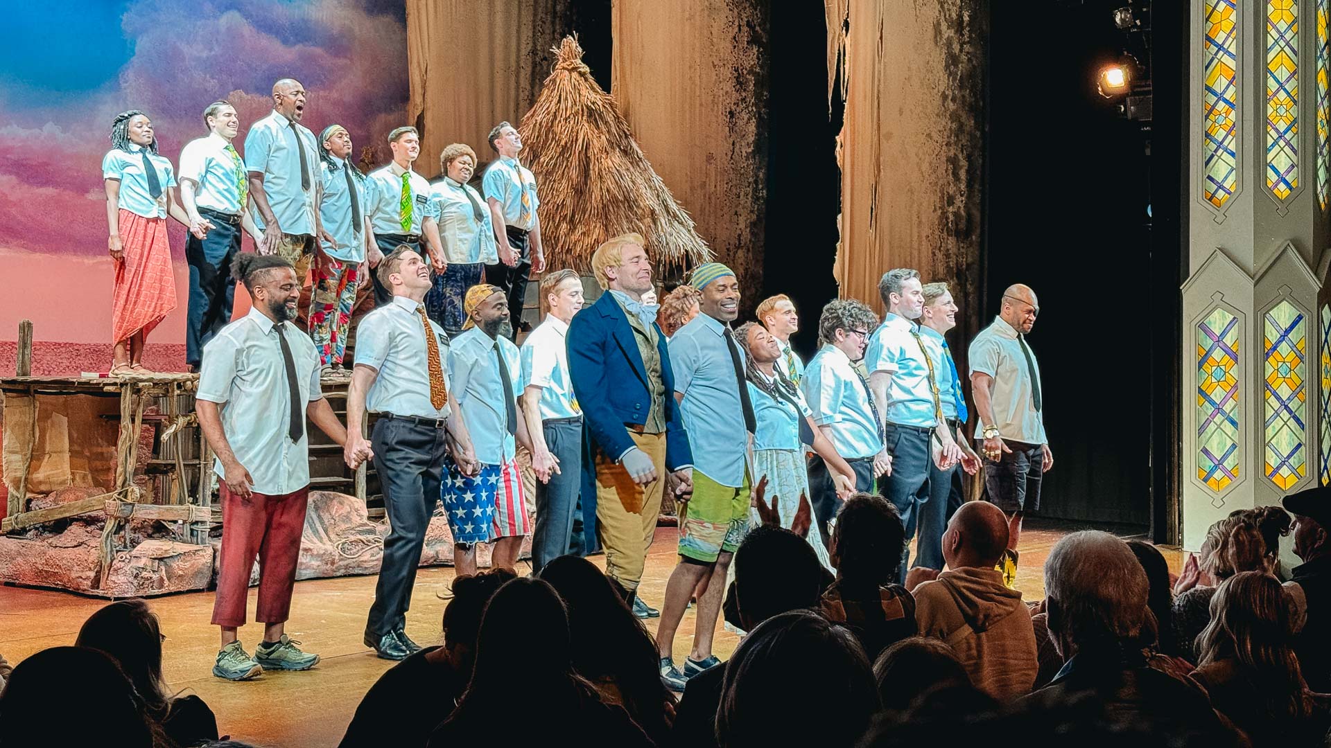 The final bow of the actors after the end of The Book of Mormon